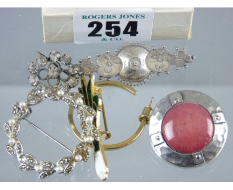 A small parcel of mixed jewellery including a Celtic type circular brooch and a circular marcasite and seed pearl wreath broo