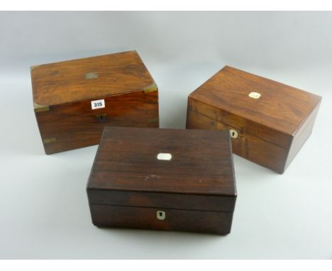 Two rosewood lidded boxes with mother of pearl top cartouche and escutcheons, both 12 x 28 cms approximately along with a wal