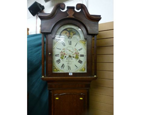 An early 19th Century oak and mahogany crossbanded longcase clock with broken swan neck pediment and arched topped door with 