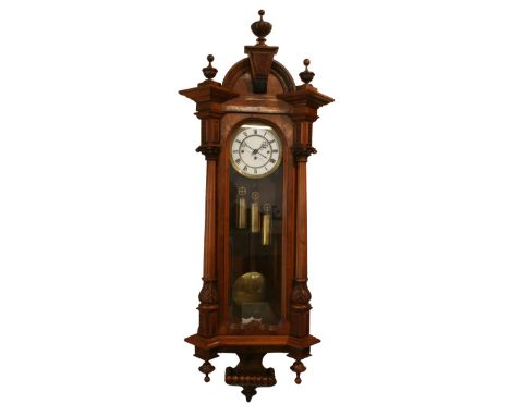 A Victorian walnut three weight Vienna style regulator, the white enamel two part dial with black Roman numerals, the unsigne
