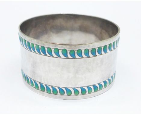 A Liberty &amp; Co. Arts and Crafts silver and enamel napkin ring, Birmingham 1930, 34g