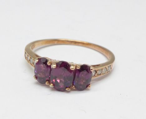 A silver gilt, amethyst and diamond ring, U 