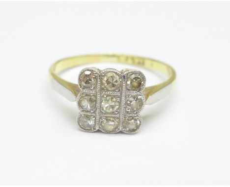 A yellow metal and platinum set nine stone diamond ring, 2.1g, L 