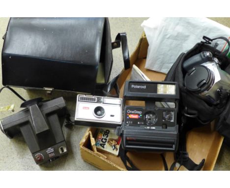 A box of Polaroid and other cameras, etc. 