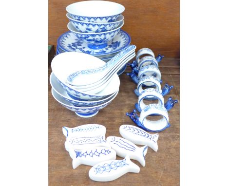 Chinese blue and white tea plates, rice bowls, napkin rings, rice spoons and fish shaped chopstick rests 