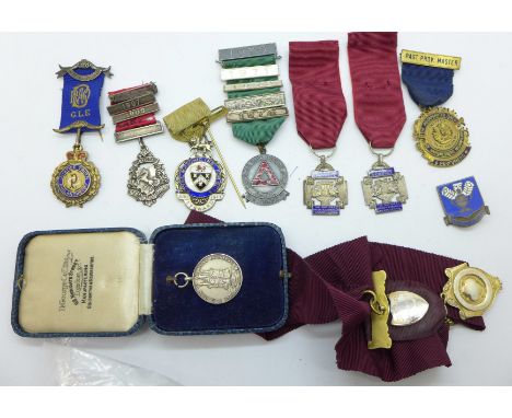 A silver and enamel USAAF, (Air Force), badge, marked Norsid Co., NYC, three silver lodge medals, a silver attendance medal w