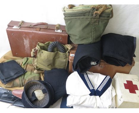 A metal trunk and a suitcase containing three sets of navy uniforms, an HMS Naval cap, Royal Navy black neck silks, a canvas 