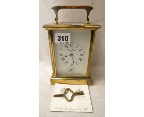 A Charles Frodsham, London brass cased carriage clock, five windows, white enamelled Roman dial with subsidiary dial below, t