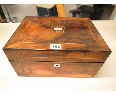 A walnut Victorian work box with mother of pearl and inlay detail, fitted interior with a small selection of work tools and a