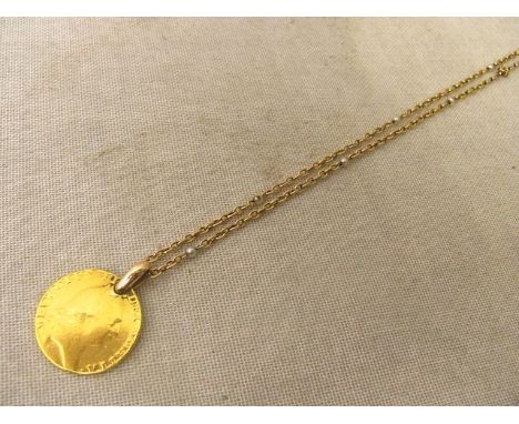 A George III gold Guinea coin on a yellow gold chain necklace with pearl spacers, date un-clear, diameter of coin 24mm, weigh