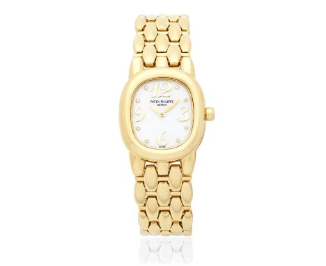 Patek Philippe. A lady's 18K gold diamond set quartz bracelet watch with mother of pearl dialModel: Golden EllipseReference: 