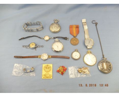 An assortment of watches including a silver fob watch