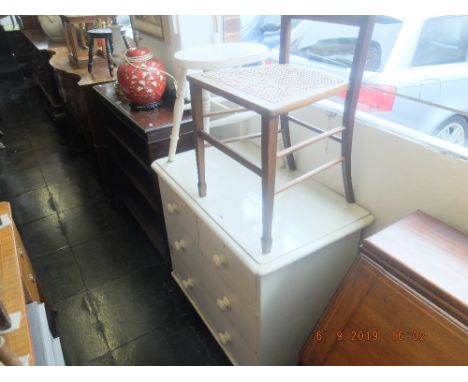 A painted pine chest of four drawers and a stool