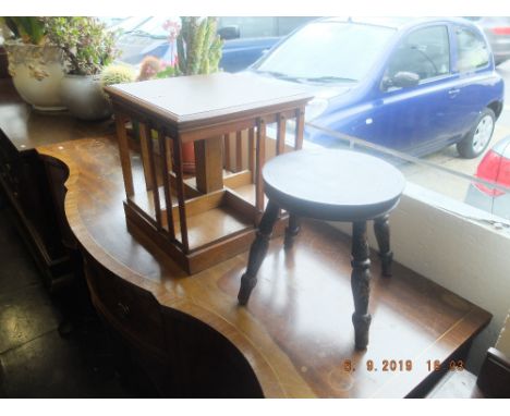 A small oak table, bookcase and a stool