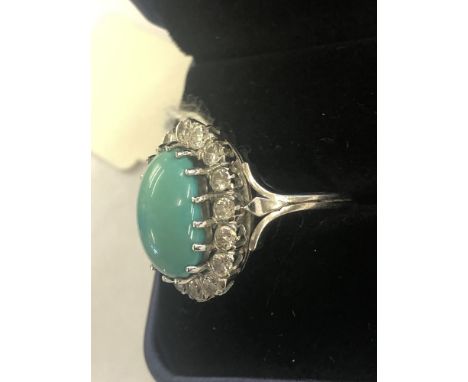 A large turquoise and diamond cluster ring set in white metal (indistinctly marked|) size K