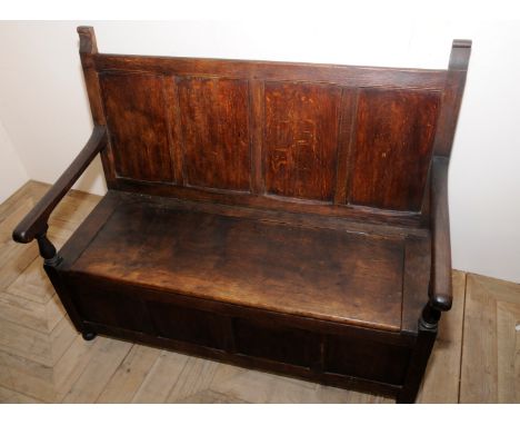 Small 19th C oak panelled back hall bench with lift up seat on bun feet (width 106.5cm)