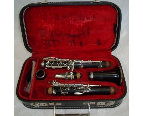 Cased Evette Buffet Of Paris clarinet stamped 'Evette & Schaeffer' with a selection of additional reeds