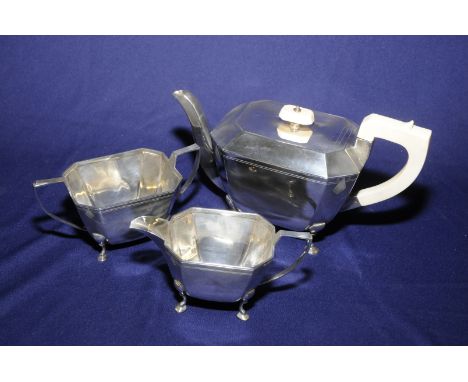 Sheffield 1935 Edward Viner Art Deco pattern three piece silver hallmarked tea service, the tea pot with ivory handle and fin