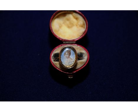 18th C unmarked gold ring set with miniature painted portrait of a young lady 