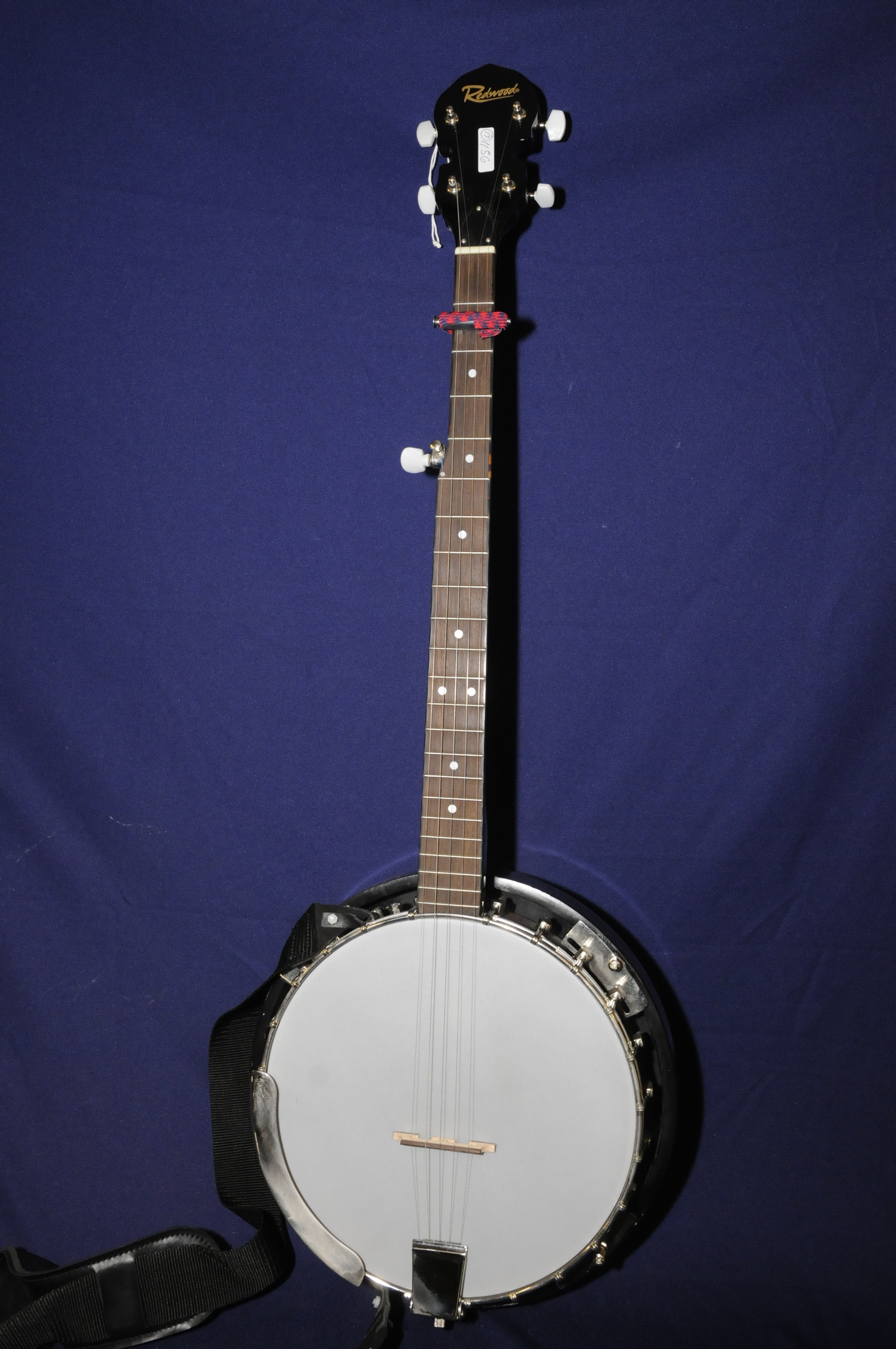 Redwood four string banjo with carry case (overall length 95cm)