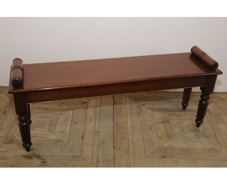 19th C mahogany window bench on fluted supports and turned hand grips (width 127cm)