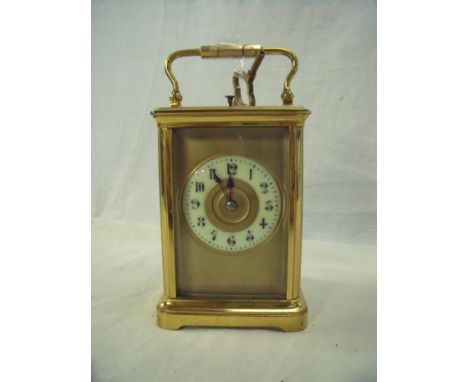 Late Victorian brass cased carriage clock with striking movement and repeating action with brass and enamel dial, 12.5cm high
