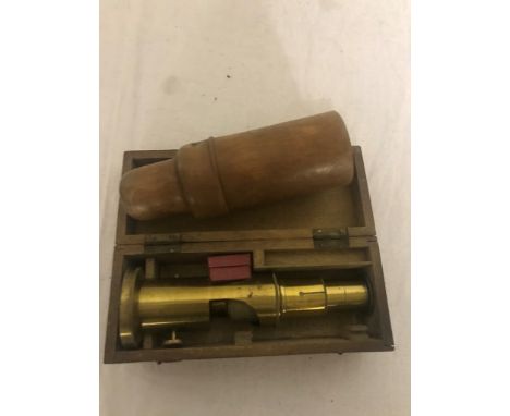 A mahogany-cased pocket microscope; together with a treen medicine bottle
