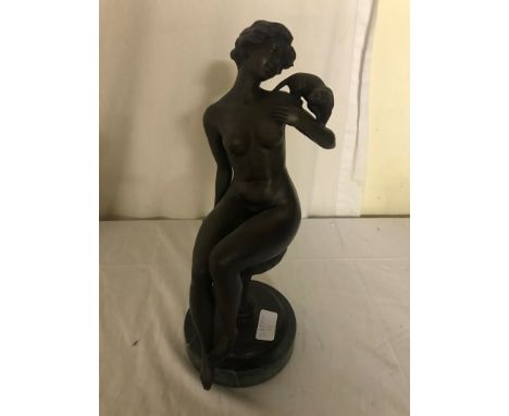 A bronze figure of a lady and cat
