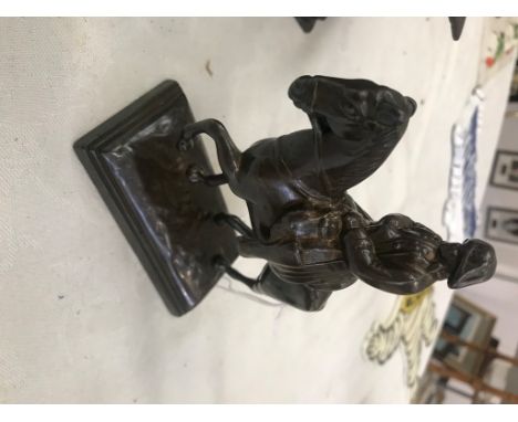 A bronze statue of Napoleon on horseback