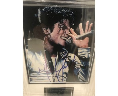 A framed &amp; glazed signed photograph of Michael Jackson with COA