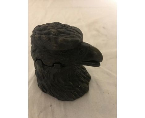 A bronze inkwell in the form of an eagle's head