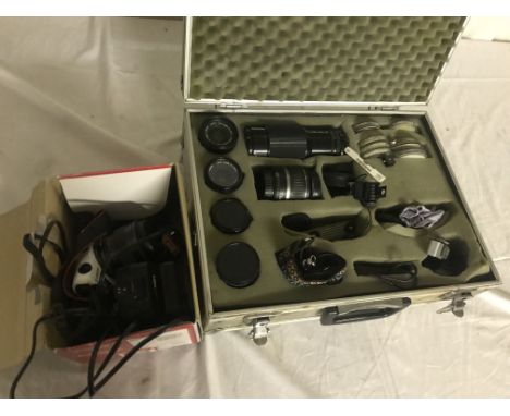 A Canon digital Eos and lenses in flight case and Casio Exilim