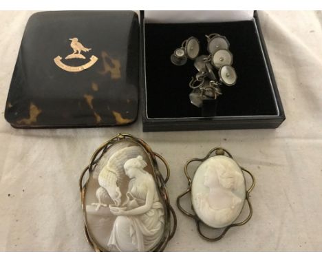 A tortoiseshell notebook; together with mother-of-pearl cufflinks and two cameos