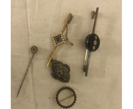 A diamond and onyx bar brooch; together with a 15ct pearl and zircon brooch and others