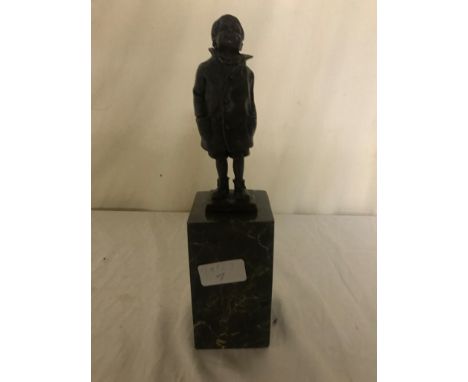 A signed bronze of a boy on marble base