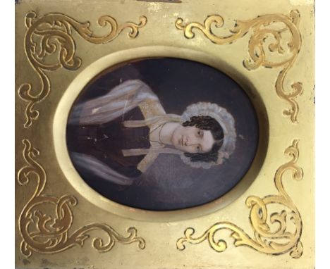 A hand-painted portrait miniature of a lady, in decorative gilt frame