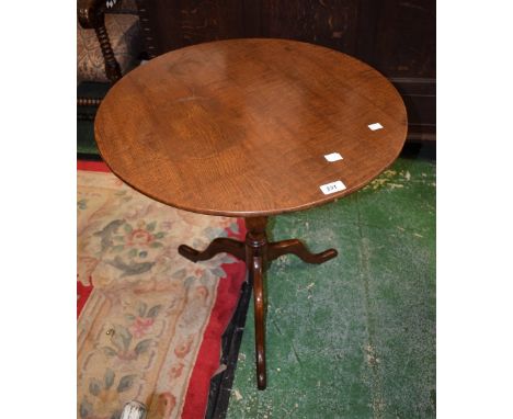 A 19th century oak tripod occasional table