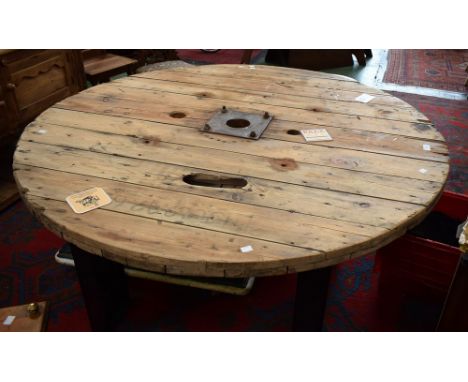 Industrial salvage - a large weathered pine cable drum table, circular top, H section girder legs. 71cm high x 139cm diameter