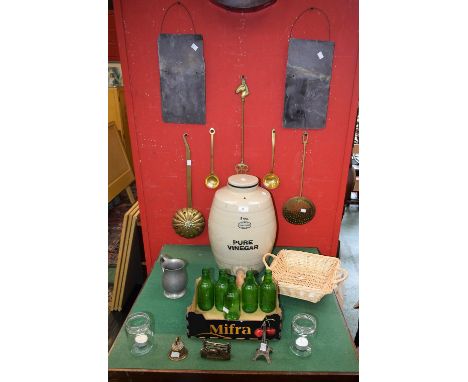 A three gallon glazed pure vinegar barrel; two wall hanging slates; brass fork, skimmer, bell etc.; glass bottles and jars; t