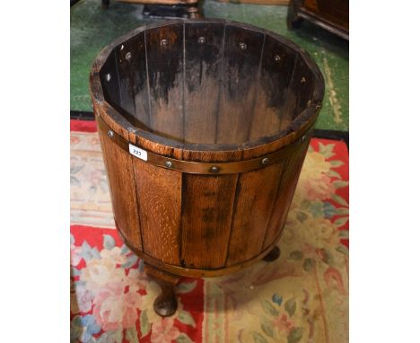 A 20th century oak coopered log barrel/stick stand