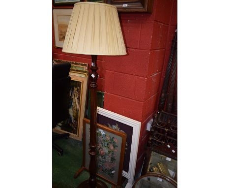 A reproduction mahogany standard lamp; an oak firescreen and a white painted firescreen 