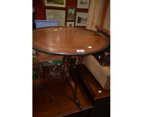 A George III oak tripod table