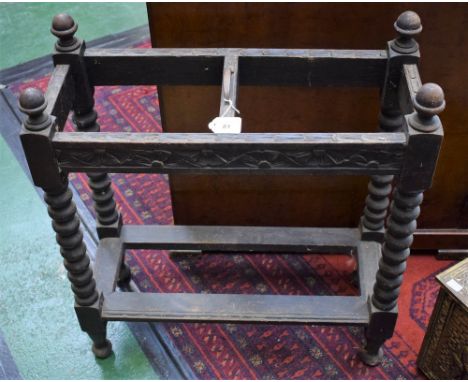 A Victorian carved oak umbrella and walking stick stand