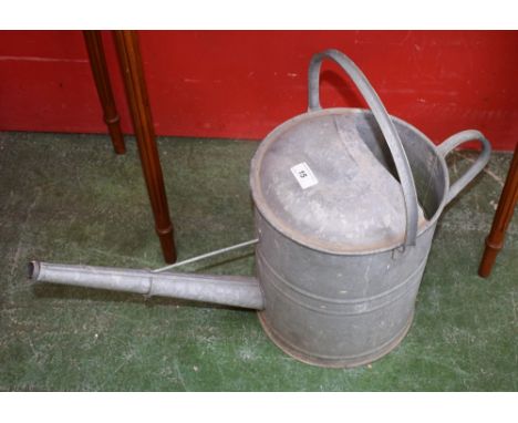 A vintage galvanized watering can.