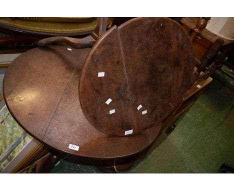 A George III oak tilt topped tripod occasional table; another, smaller (2)