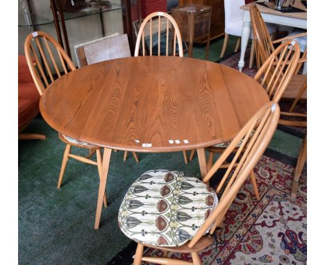 An Ercol dropleaf table and four Ercol spindle back chairs