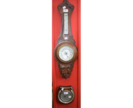 An oak cased Aneroid barometer with thermometer; an Art Deco style barometer, horseshoe mounted