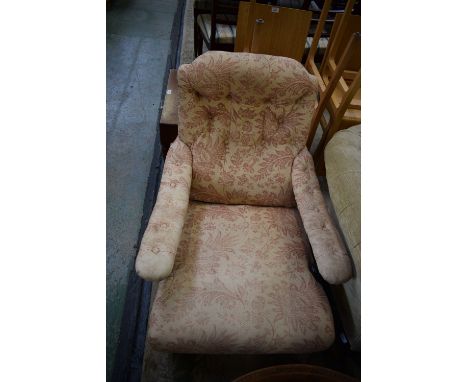 A Victorian mahogany library chair, button upholstered back and arms, stuffed overseat, turned forelegs, ceramic casters 