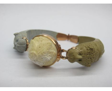 A XIX Century Etruscan Revival Lava Bangle, of three colour design, hinged to dome snap clasp (repair). 