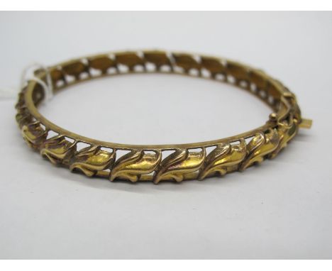 An Openwork Bangle, of stylised leaf design, hinged to snap clasp, stamped "22c".